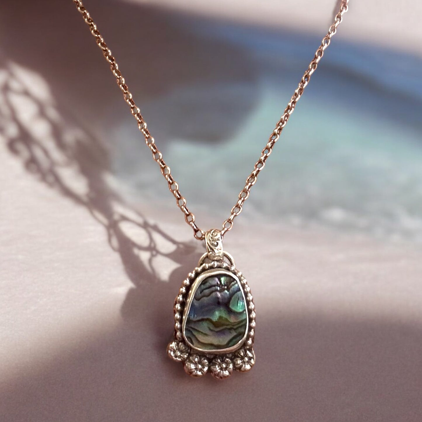 Paua shell pendant necklace with sterling silver hand forged detailing