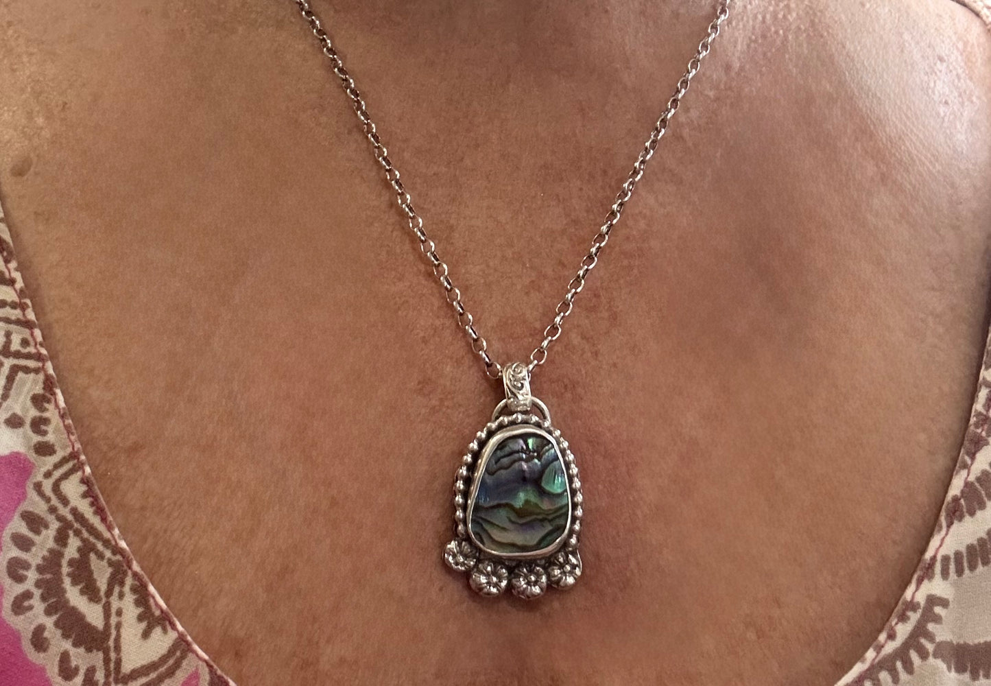 Paua shell pendant necklace with sterling silver hand forged detailing