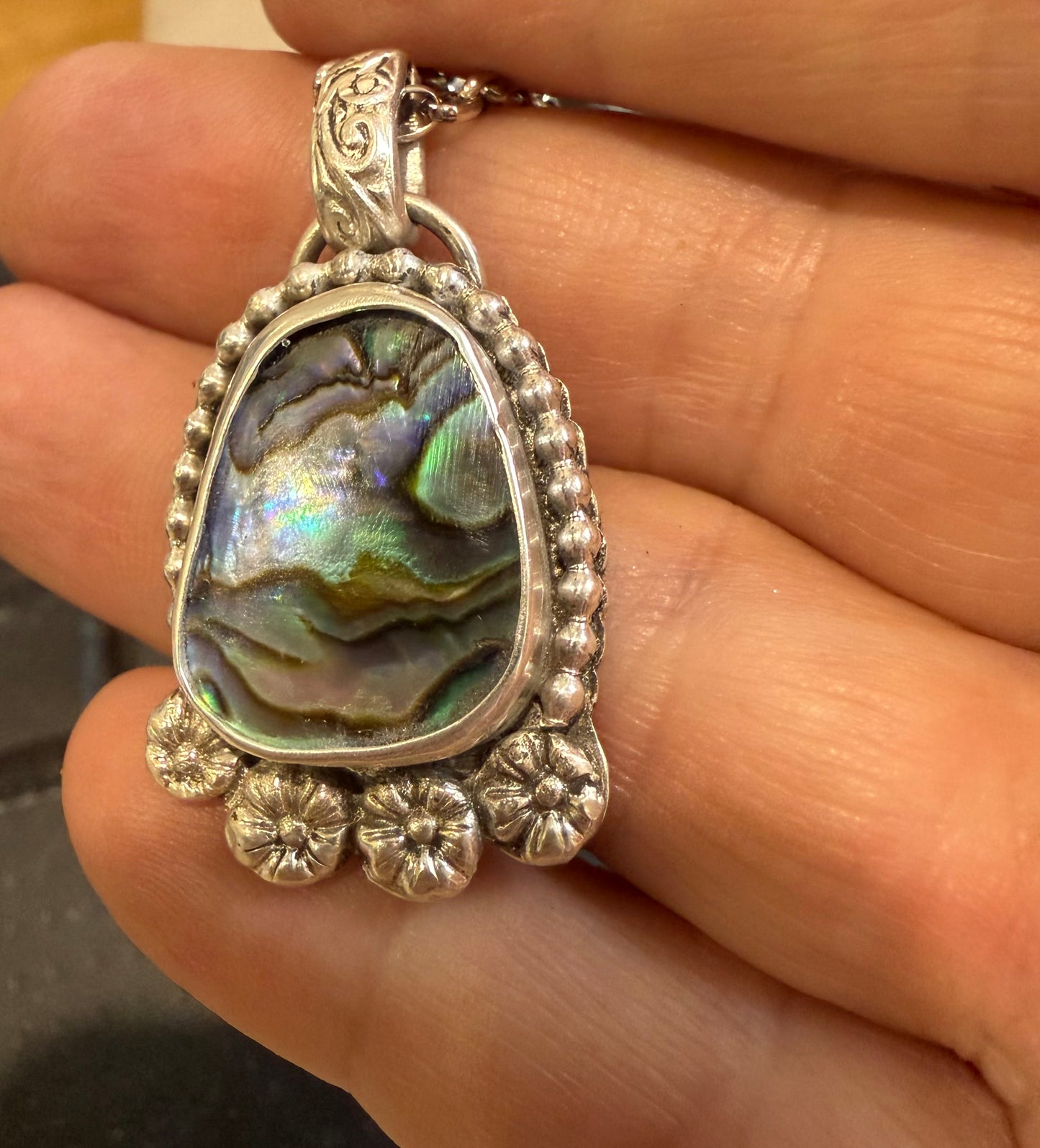 Paua shell pendant necklace with sterling silver hand forged detailing